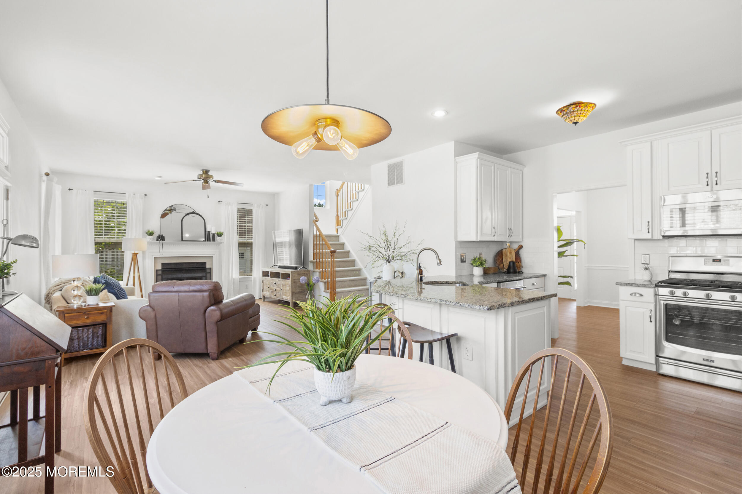 27 Danella Way Howell, NJ 07731 - Photo 2 of 25 a view of a dining room with furniture and wooden floor