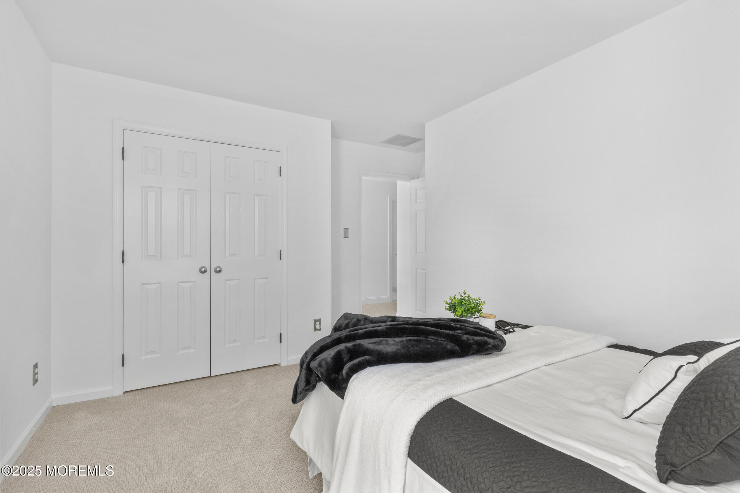 27 Danella Way Howell, NJ 07731 - Photo 21 of 25 a bedroom with a bed and a cabinets