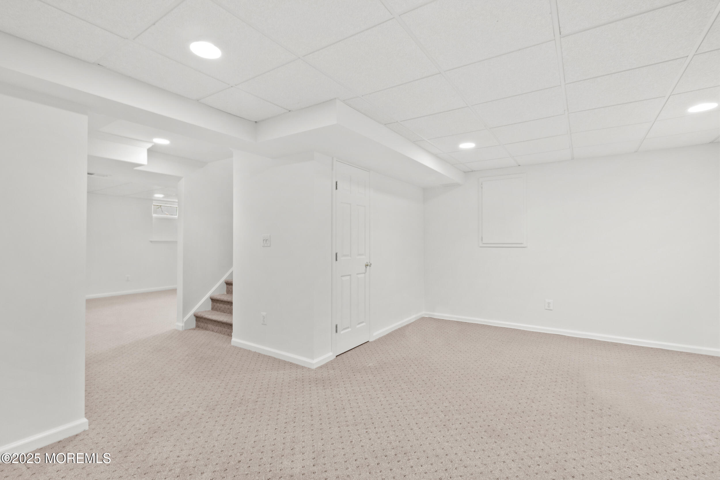 27 Danella Way Howell, NJ 07731 - Photo 22 of 25 an empty room with white walls and tiles