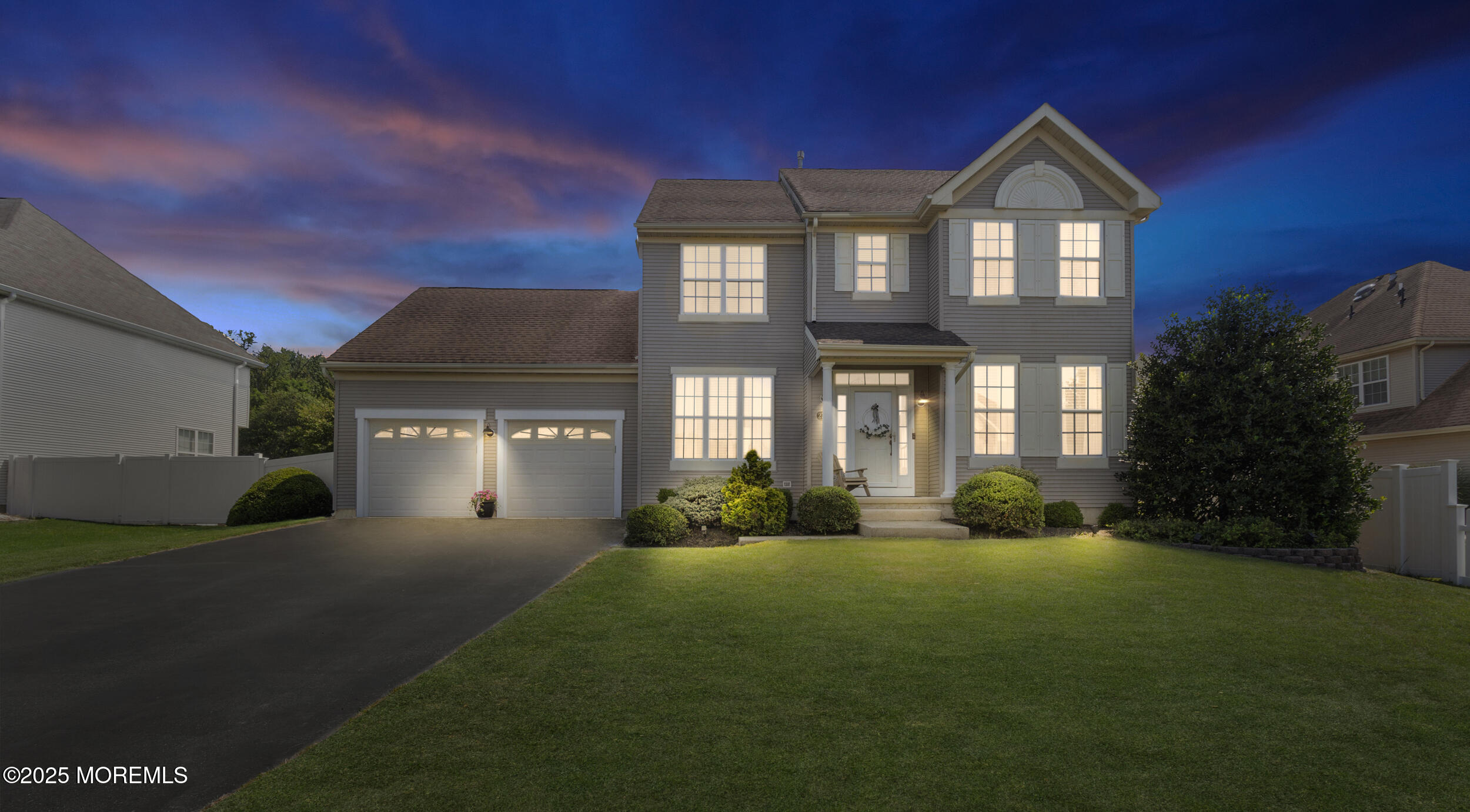 27 Danella Way Howell, NJ 07731 - Photo 25 of 25 a front view of a house with a yard and garage