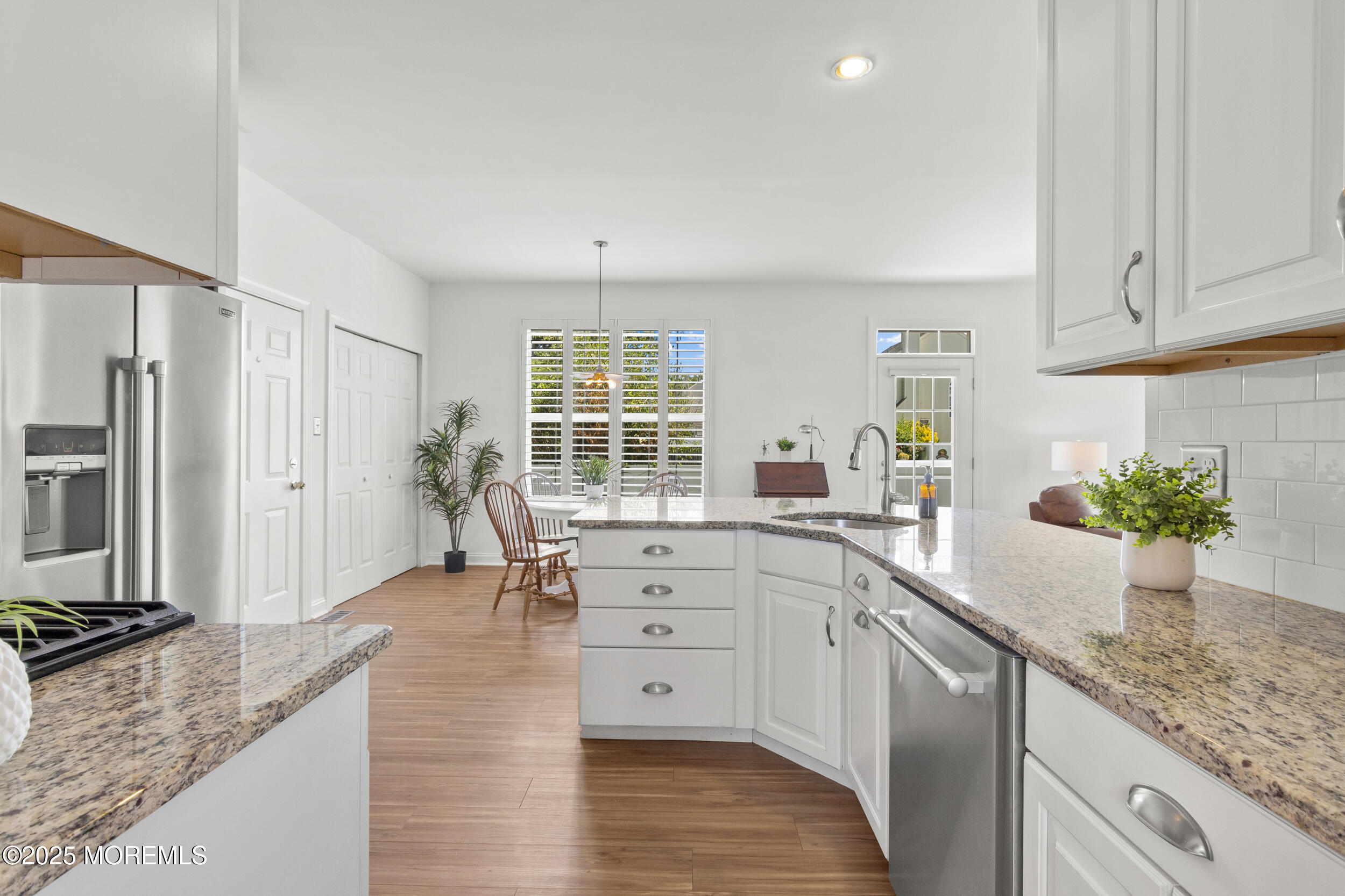 27 Danella Way Howell, NJ 07731 - Photo 6 of 25 a kitchen with white cabinets and window