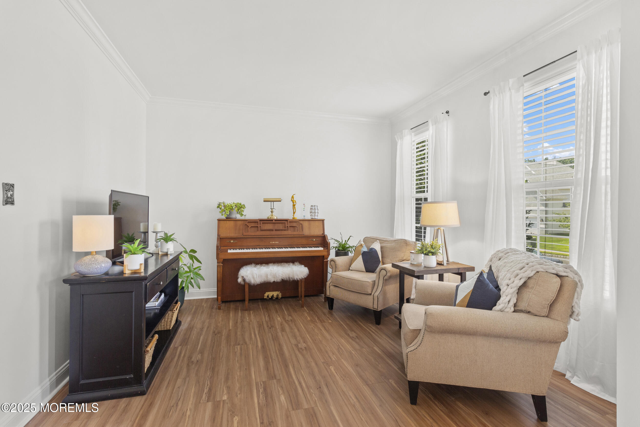 27 Danella Way Howell, NJ 07731 - Photo 9 of 25 a bedroom with furniture and a wooden floor