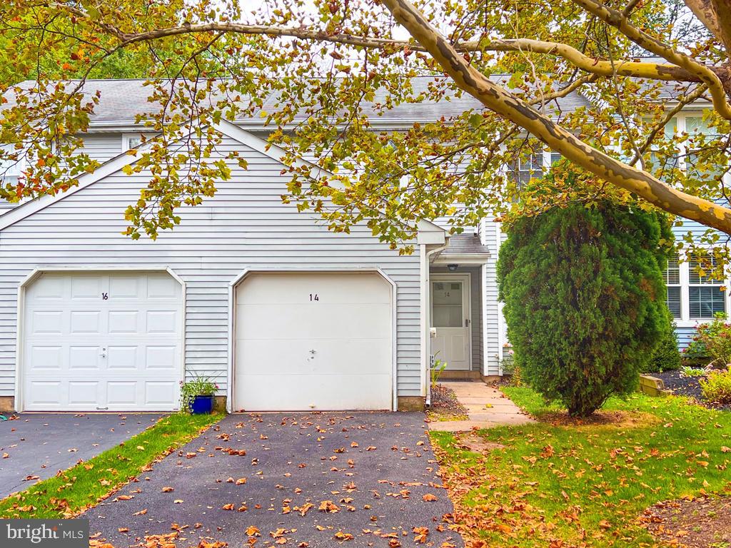 14 Carousel Circle Doylestown, PA 18901 - Photo 1 of 35 a front view of a house with a yard and garage
