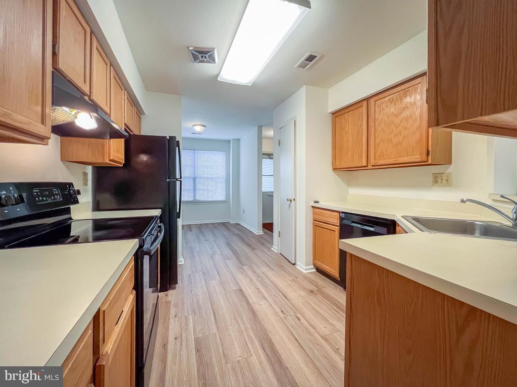 14 Carousel Circle Doylestown, PA 18901 - Photo 11 of 35 a kitchen with a sink a counter top space stainless steel appliances and a window