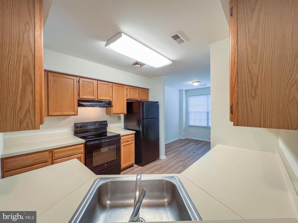 14 Carousel Circle Doylestown, PA 18901 - Photo 13 of 35 a kitchen with stainless steel appliances granite countertop a sink stove and refrigerator