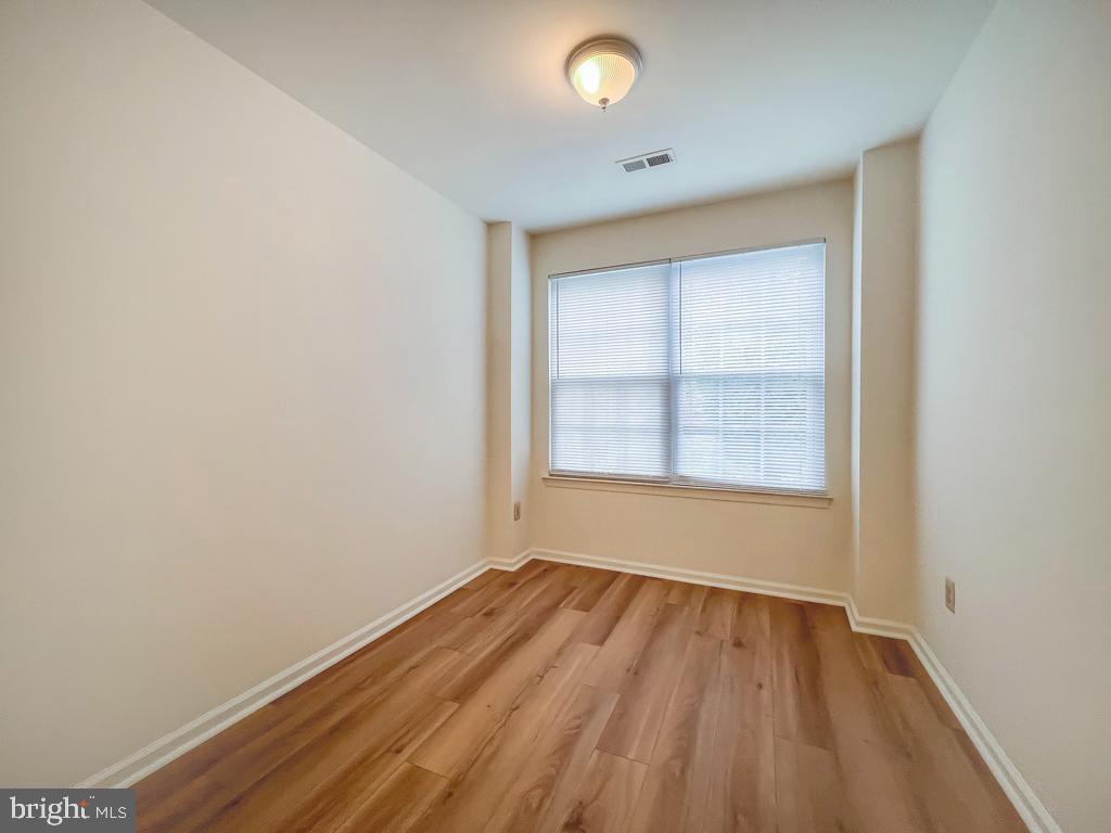 14 Carousel Circle Doylestown, PA 18901 - Photo 15 of 35 an empty room with wooden floor and windows