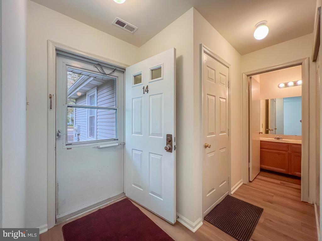 14 Carousel Circle Doylestown, PA 18901 - Photo 16 of 35 a view of a hallway view with wooden floor and a bathroom
