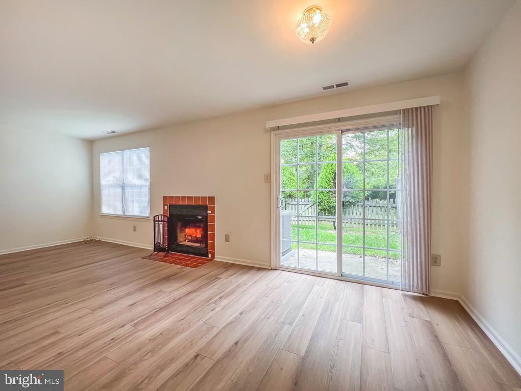 14 Carousel Circle Doylestown, PA 18901 - Photo 3 of 35 an empty room with wooden floor and windows