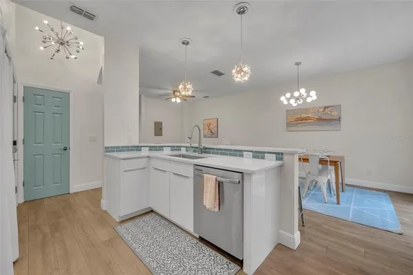a bathroom with a sink vanity and a mirror