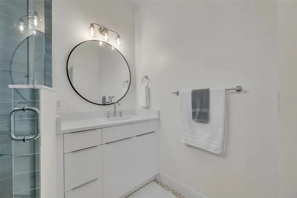 a bathroom with a sink and a mirror