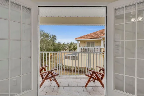 a view of balcony with furniture