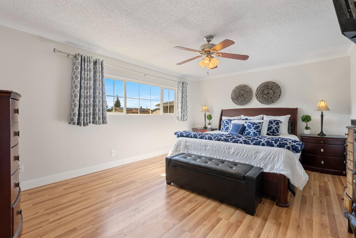 6570 Thames Drive Gilroy, CA 95020 - Photo 17 of 30 a bedroom with a bed and wooden floor