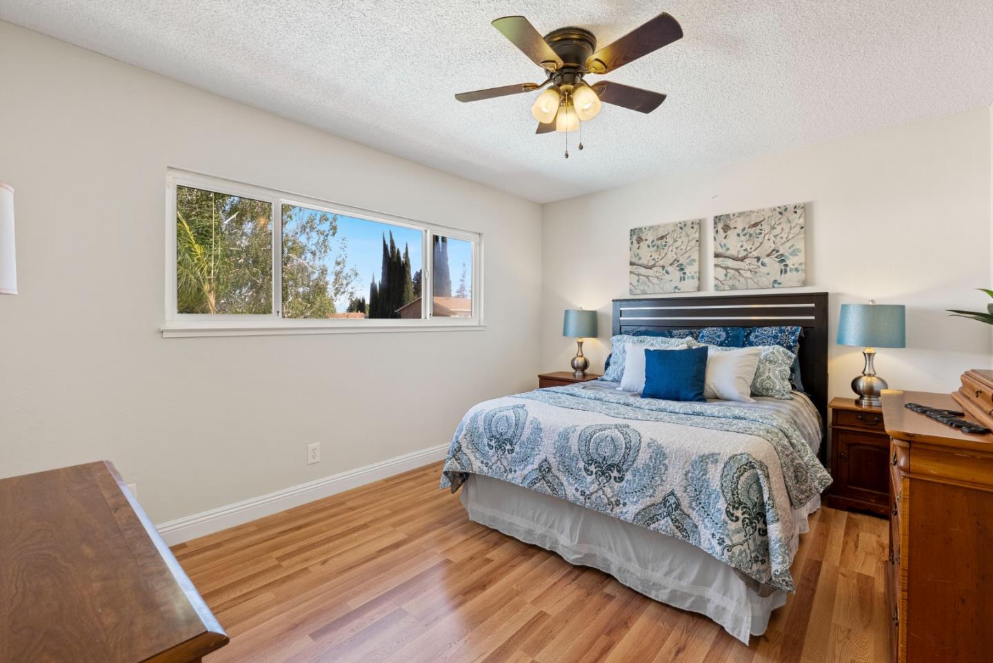 6570 Thames Drive Gilroy, CA 95020 - Photo 20 of 30 a bedroom with a large bed and a chandelier