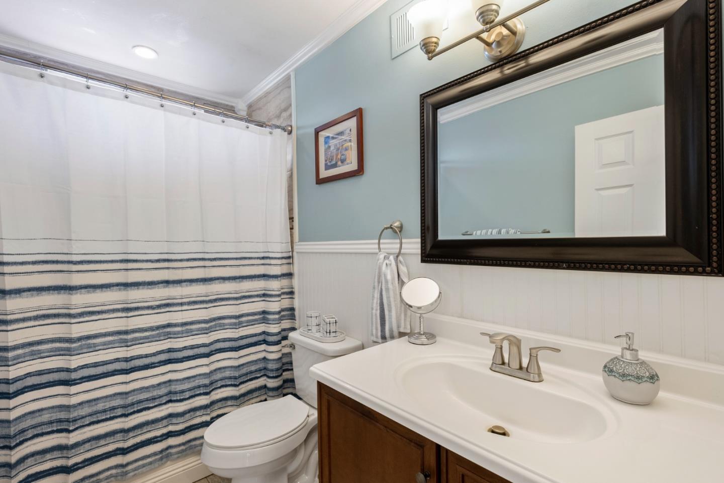 6570 Thames Drive Gilroy, CA 95020 - Photo 23 of 30 a bathroom with a sink a toilet and mirror