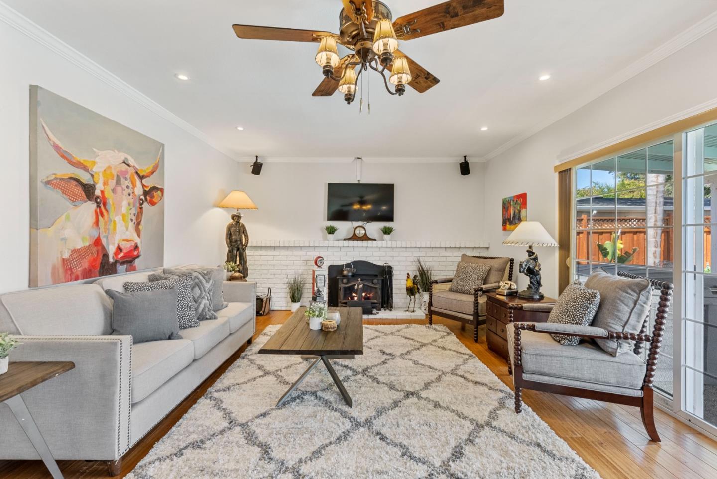 6570 Thames Drive Gilroy, CA 95020 - Photo 8 of 30 a living room with furniture a flat screen tv and a fireplace