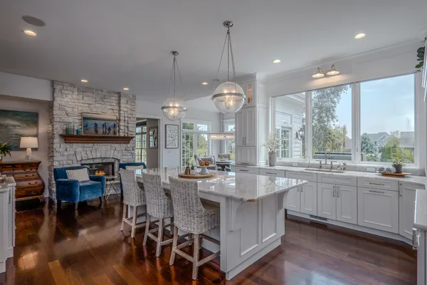 a blue chair sitting in front of a window
