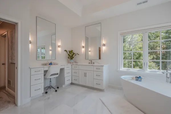 a spacious bedroom with a bed and a couch