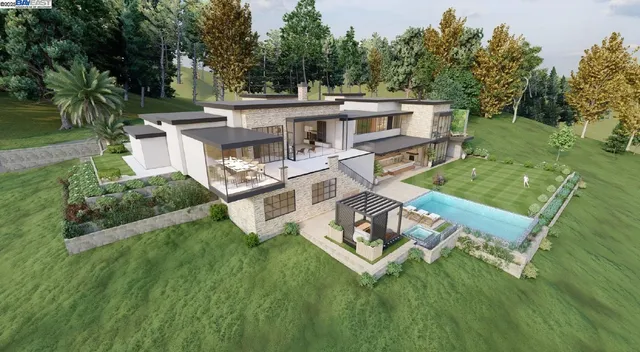 a aerial view of a house with a yard table and chairs