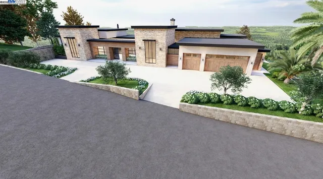 a front view of a house with a yard and a garage