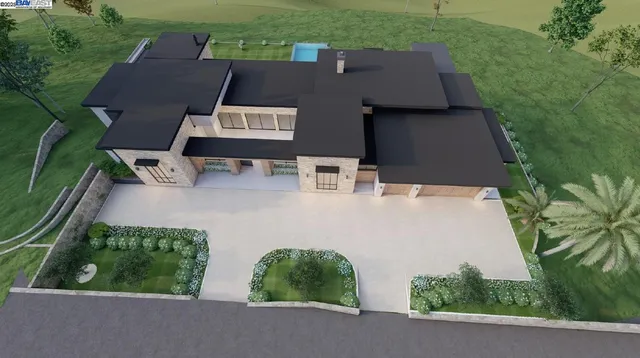 an aerial view of a house with garden space and street view