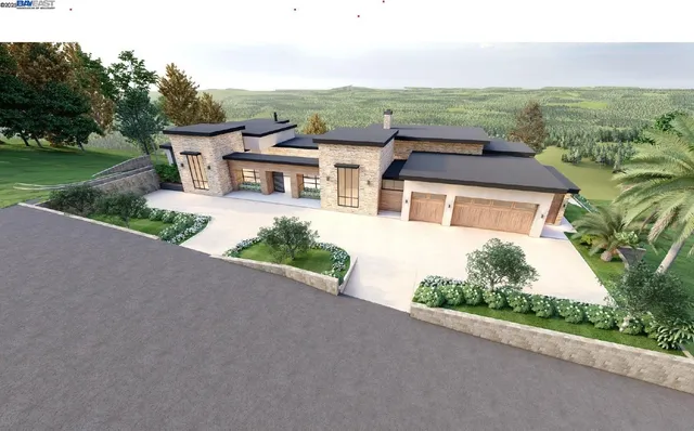 a front view of a house with a yard and potted plants