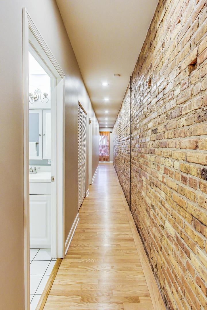 4061 North Sheridan Road, Unit 1 Chicago, IL 60613 - Photo 13 of 26 a view of gallery with wooden floor