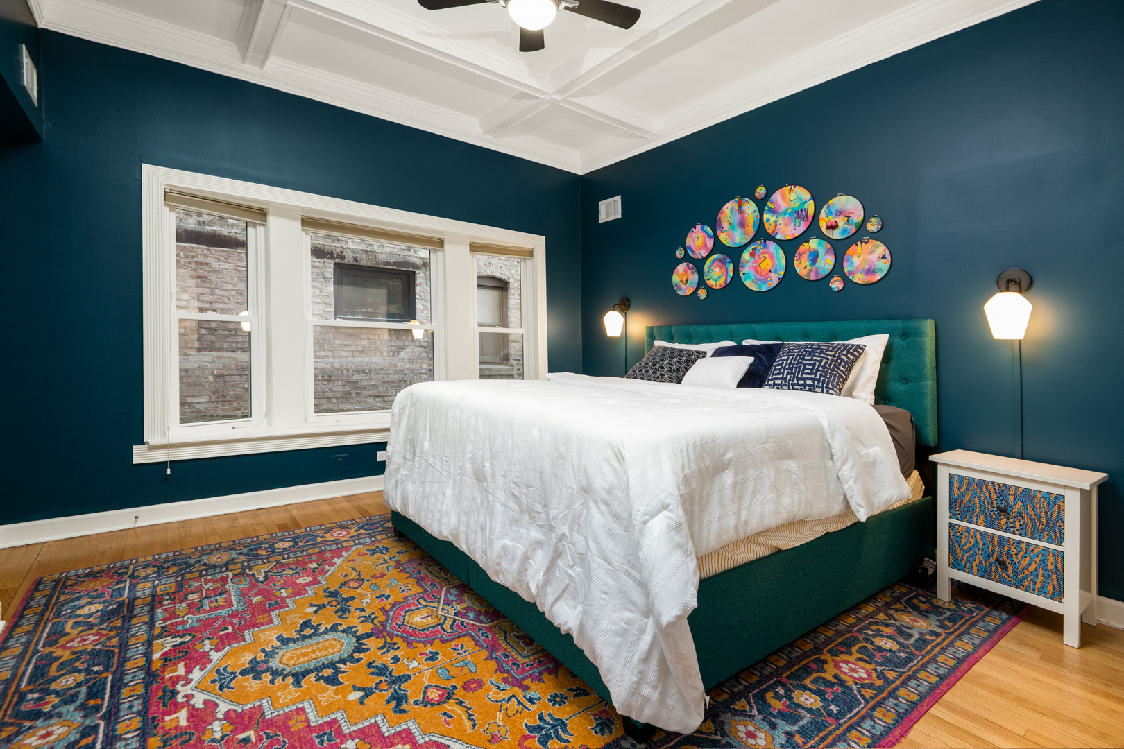 4061 North Sheridan Road, Unit 1 Chicago, IL 60613 - Photo 14 of 26 a bedroom with a bed and a painting on the wall