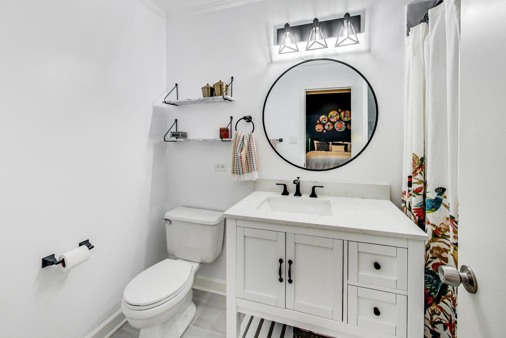 4061 North Sheridan Road, Unit 1 Chicago, IL 60613 - Photo 15 of 26 a bathroom with a sink and a mirror