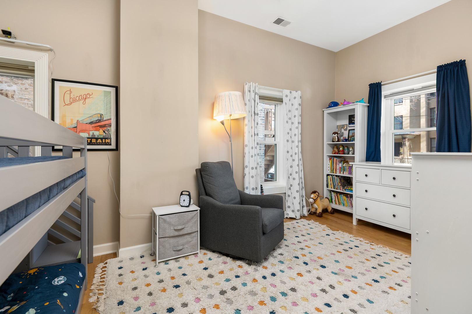 4061 North Sheridan Road, Unit 1 Chicago, IL 60613 - Photo 17 of 26 a bedroom with a bed and furniture