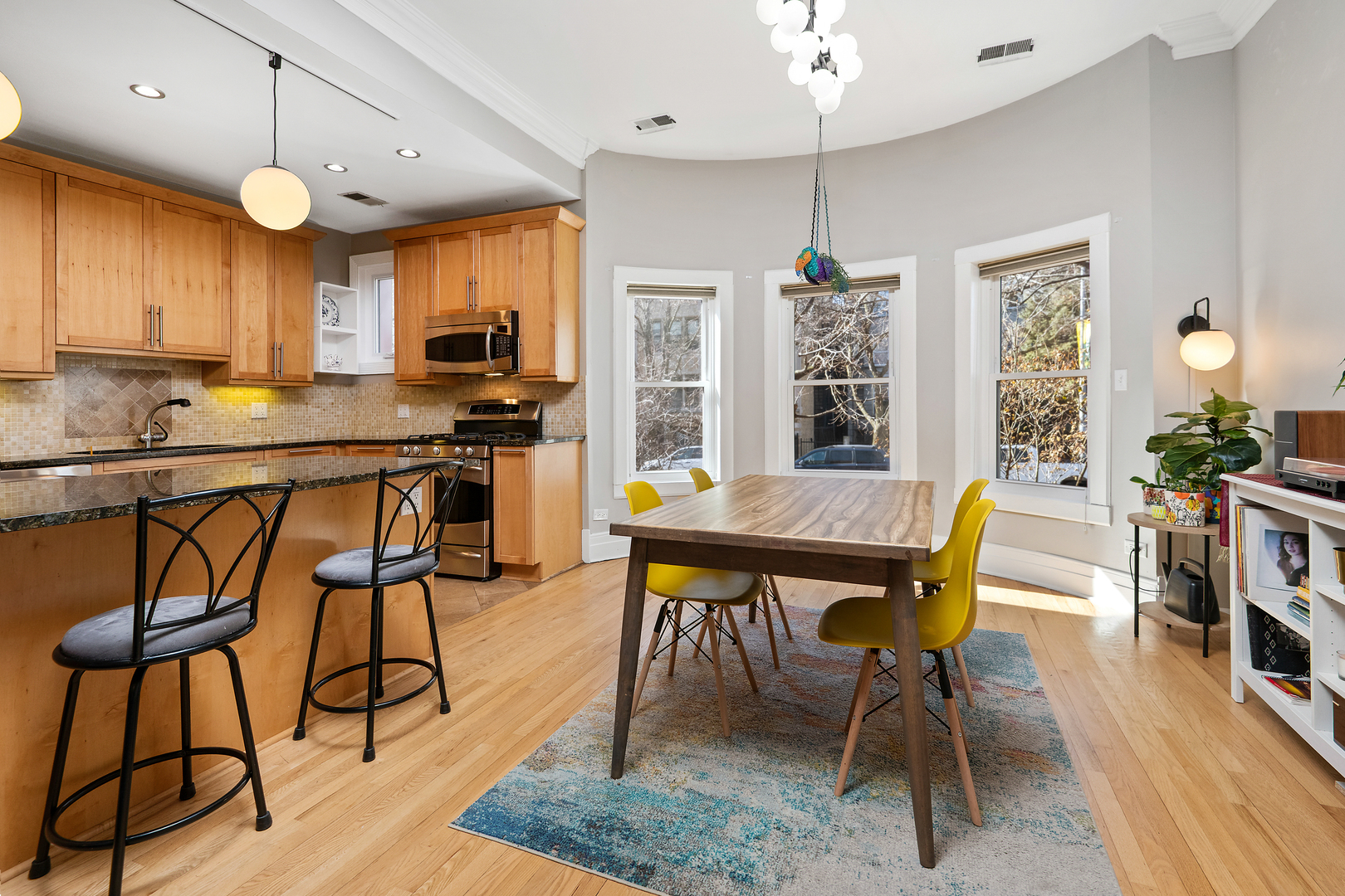 4061 North Sheridan Road, Unit 1 Chicago, IL 60613 - Photo 10 of 26 a view of a dining room with furniture and wooden floor