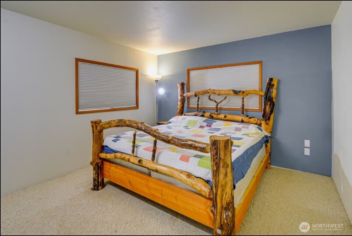 54 Pacific Lane Pacific Beach, WA 98571 - Photo 19 of 37 a bed sitting in a bedroom next to a window