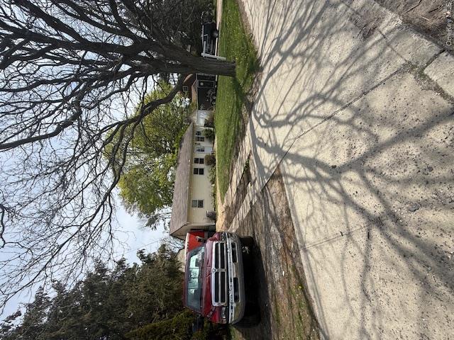 511 Wicks Road Brentwood, NY 11717 - Photo 1 of 4 a view of street with parked cars