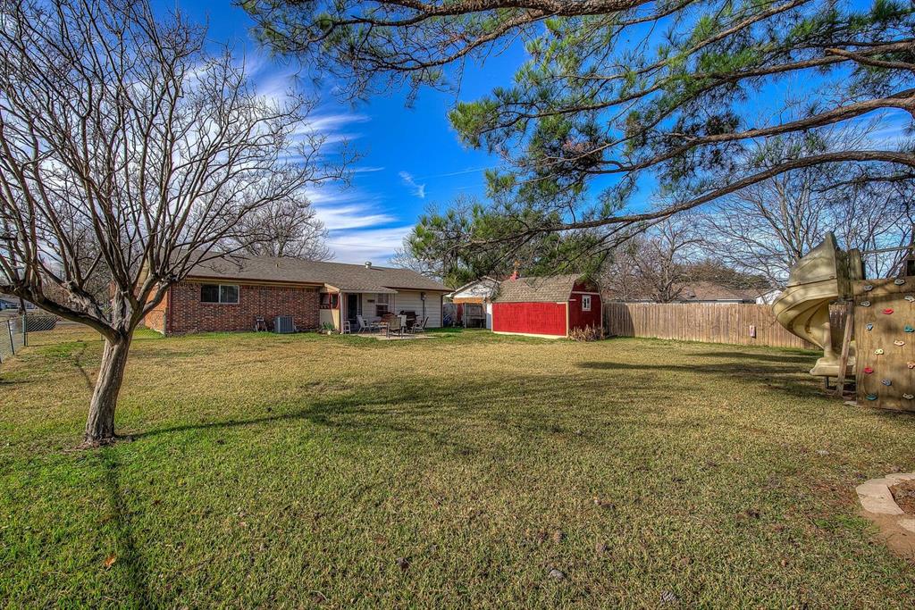 307 East McCoulskey Street Terrell, TX 75160 - Photo 3 of 16 a front view of a house with a yard