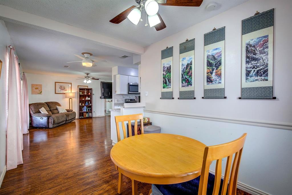 307 East McCoulskey Street Terrell, TX 75160 - Photo 5 of 16 a view of a dining room with furniture and wooden floor