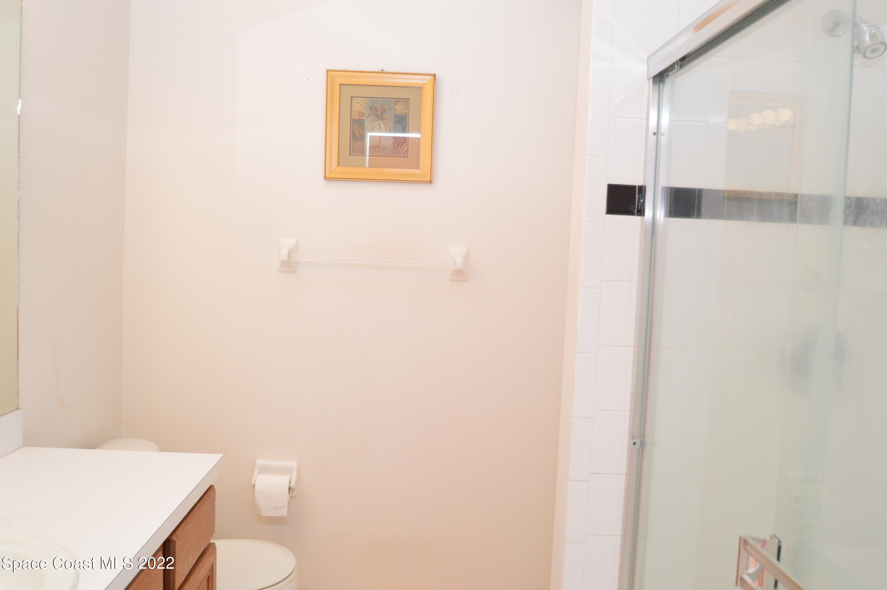 274 Intrepid Way Indialantic, FL 32903 - Photo 14 of 23 a bathroom with a toilet and a sink