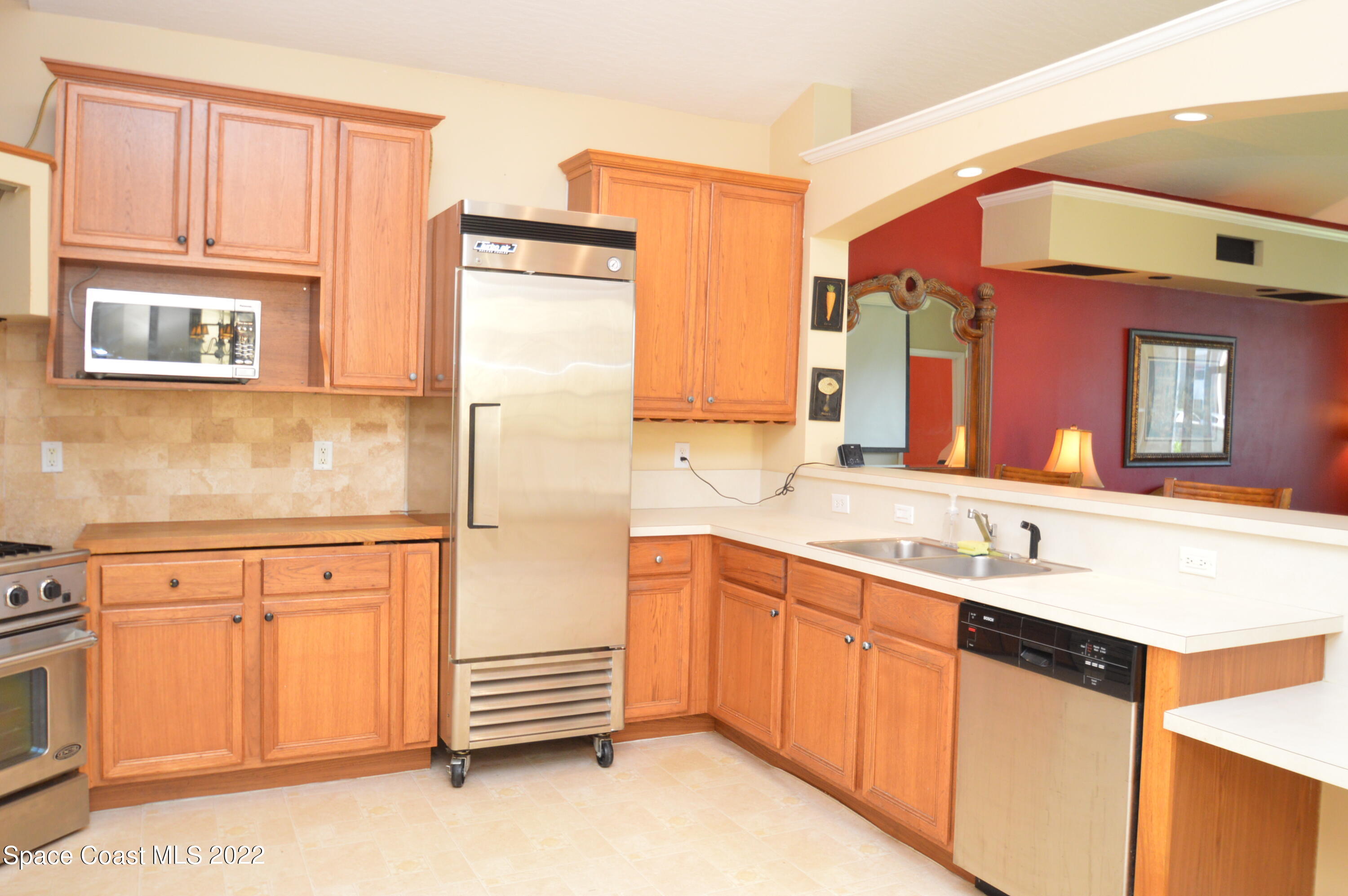 274 Intrepid Way Indialantic, FL 32903 - Photo 18 of 23 a bathroom with a sink and a mirror