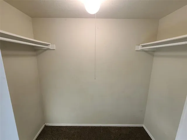 a view of small space with racks on the wall