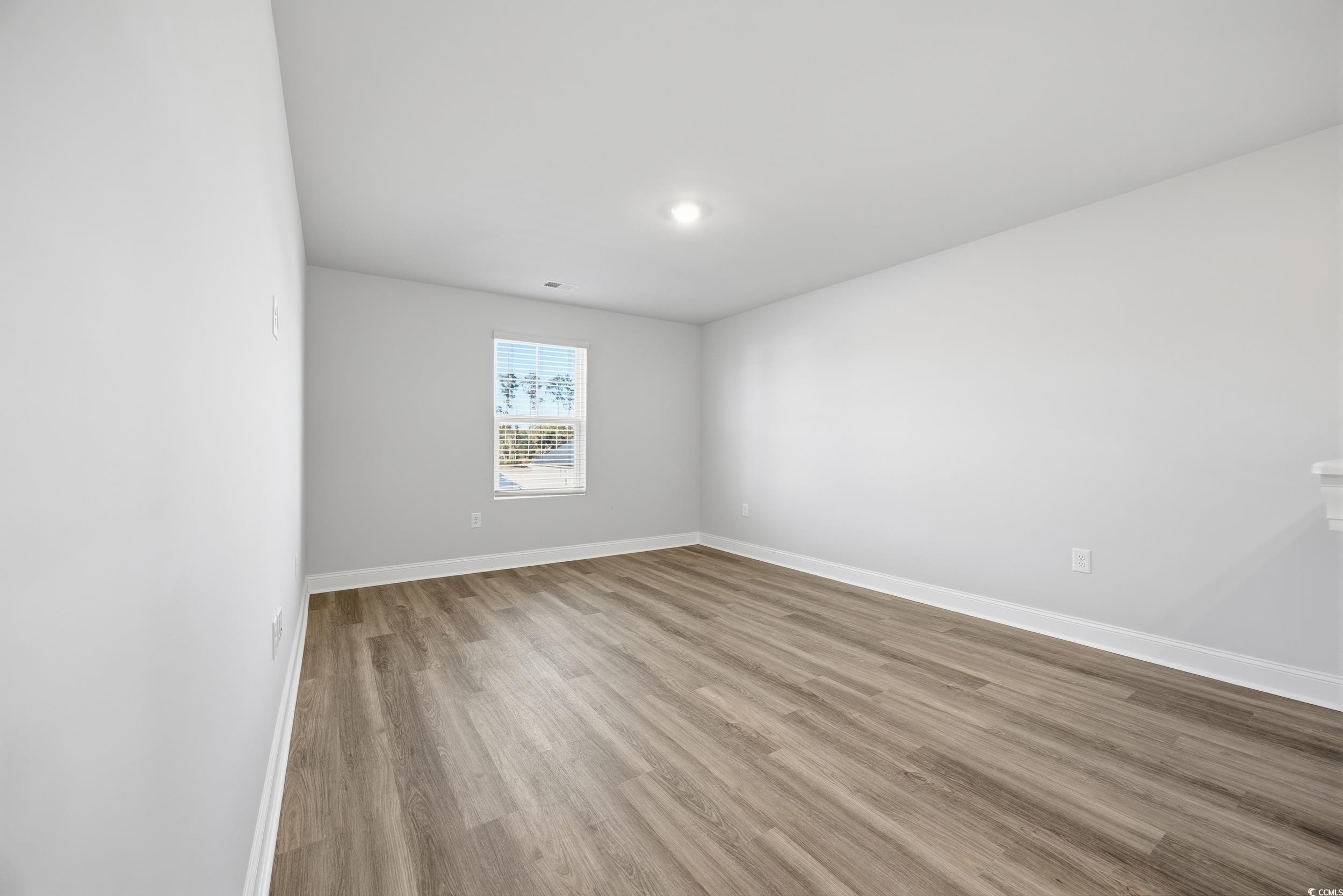 1052 Kinness Drive Conway, SC 29527 - Photo 13 of 38 Spare room with light wood-style flooring and baseboards