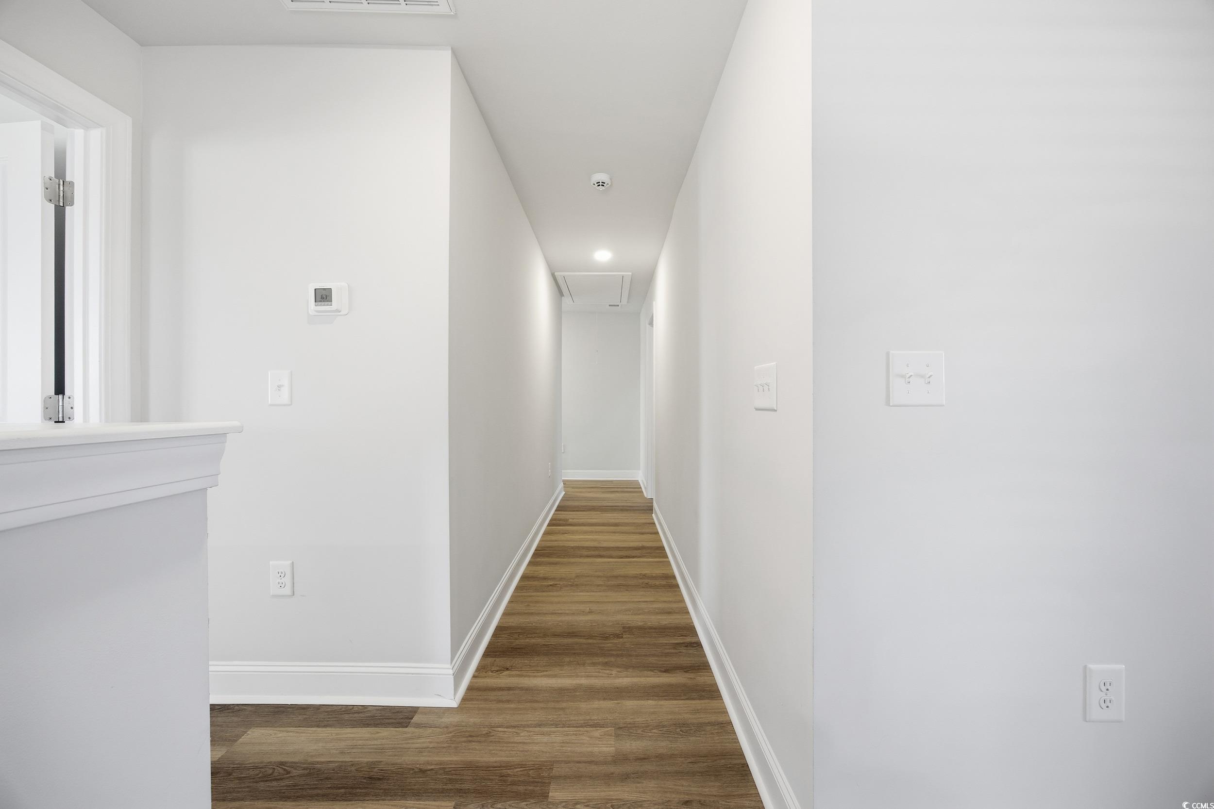 1052 Kinness Drive Conway, SC 29527 - Photo 15 of 38 Hallway featuring dark wood finished floors, recessed lighting, and attic access
