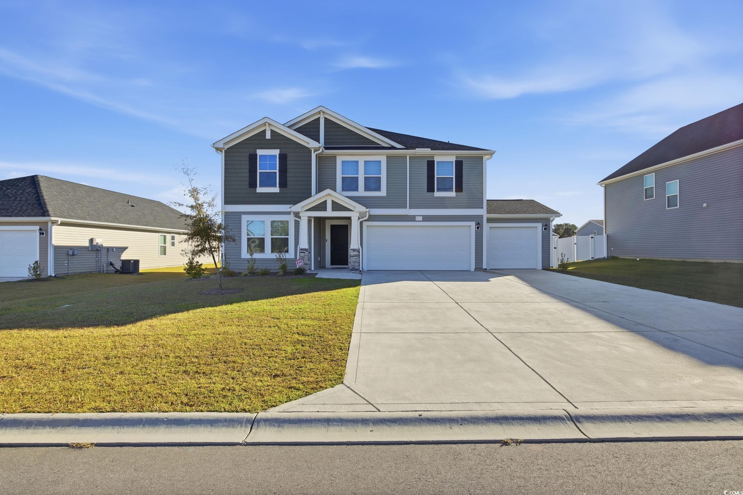 1052 Kinness Drive Conway, SC 29527 - Photo 2 of 38 Craftsman house with driveway, an attached garage, and stone siding