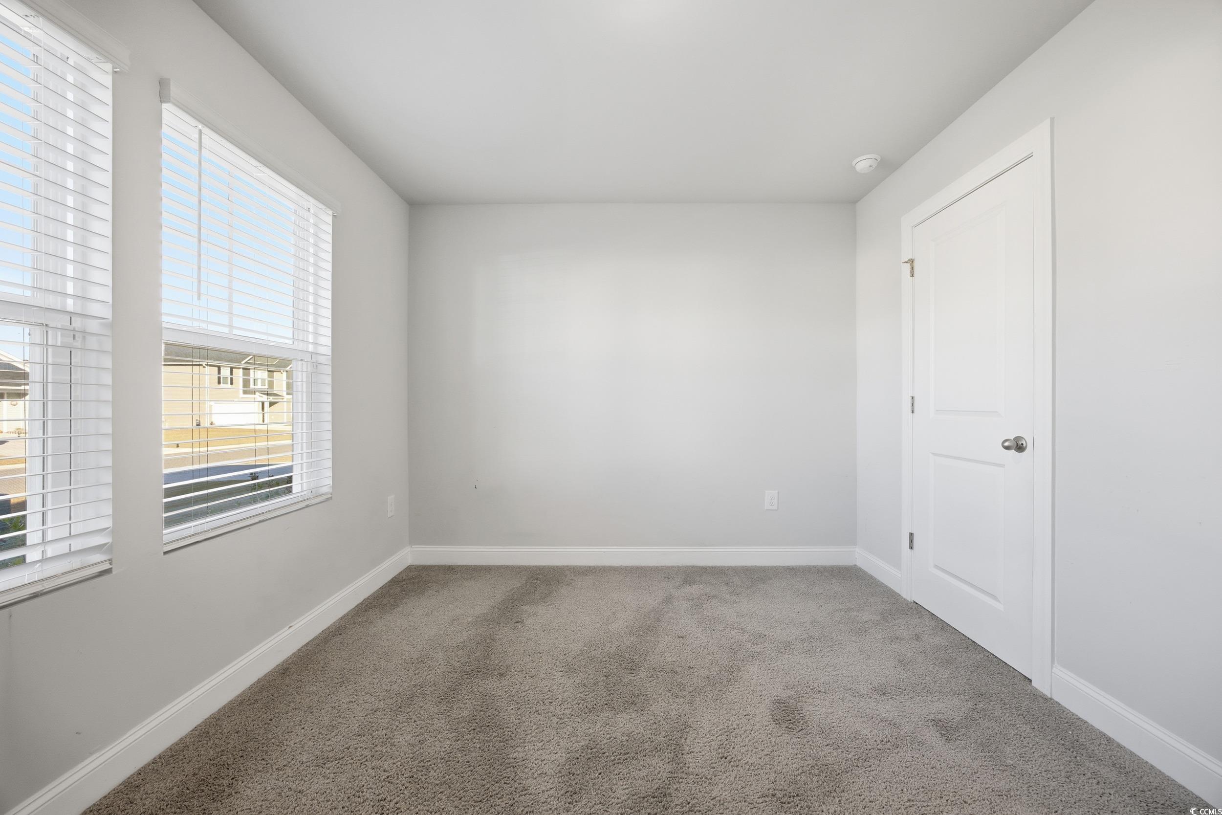 1052 Kinness Drive Conway, SC 29527 - Photo 8 of 38 Empty room with light colored carpet and baseboards