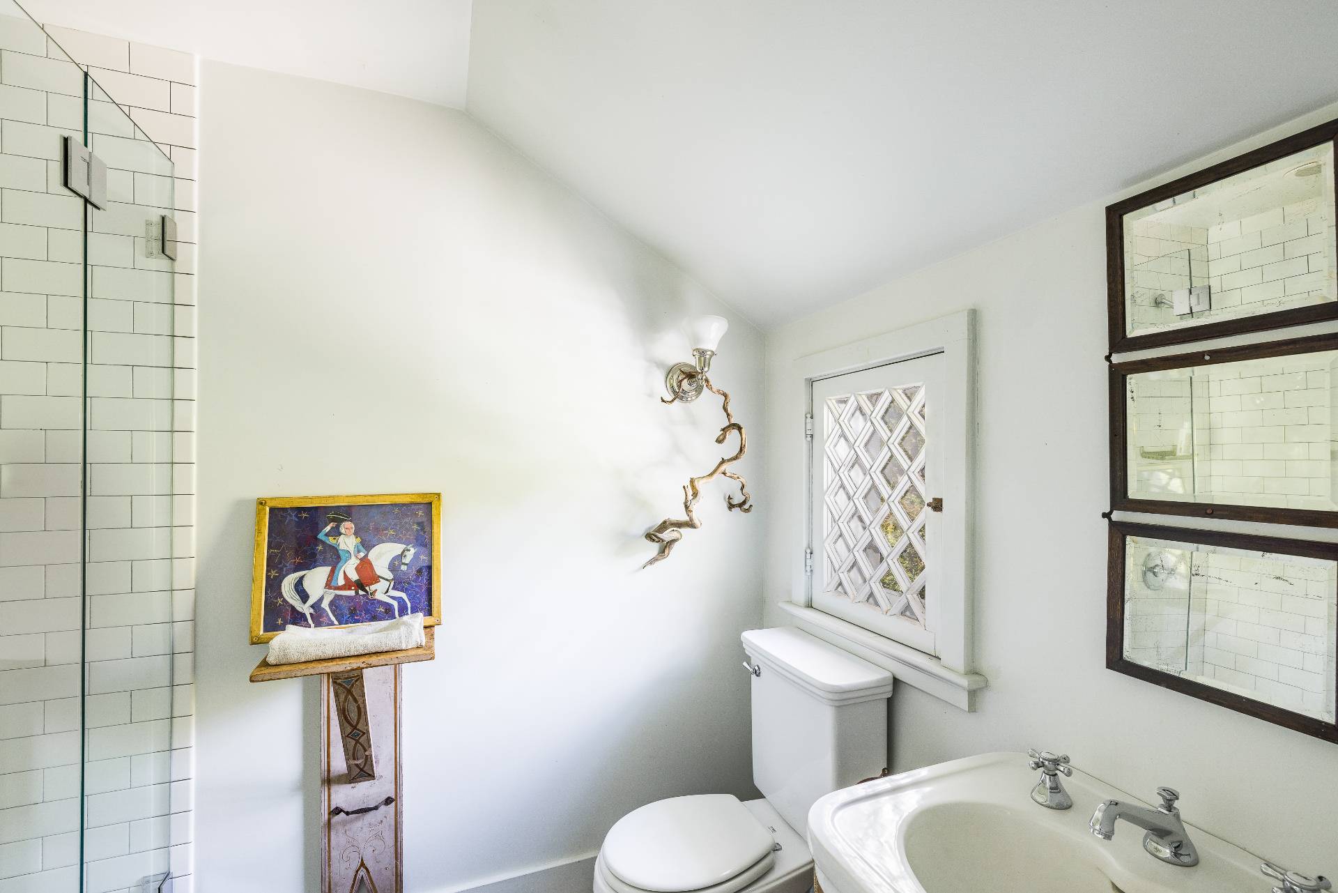 56 Sagaponack Road Bridgehampton, NY 11932 - Photo 16 of 23 a bathroom with a toilet sink and mirror