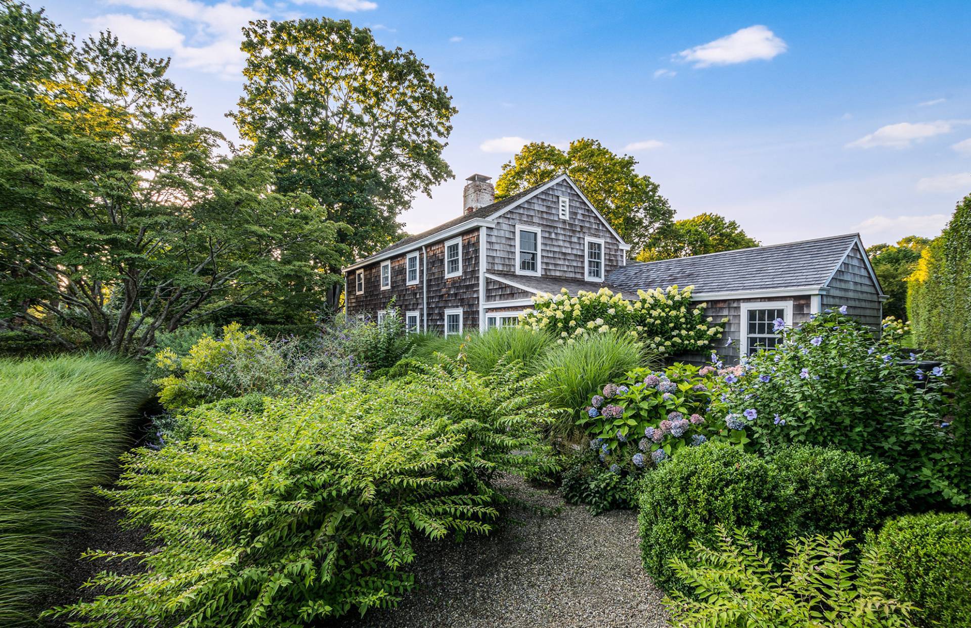 56 Sagaponack Road Bridgehampton, NY 11932 - Photo 19 of 23 a view of a house with a yard and garden