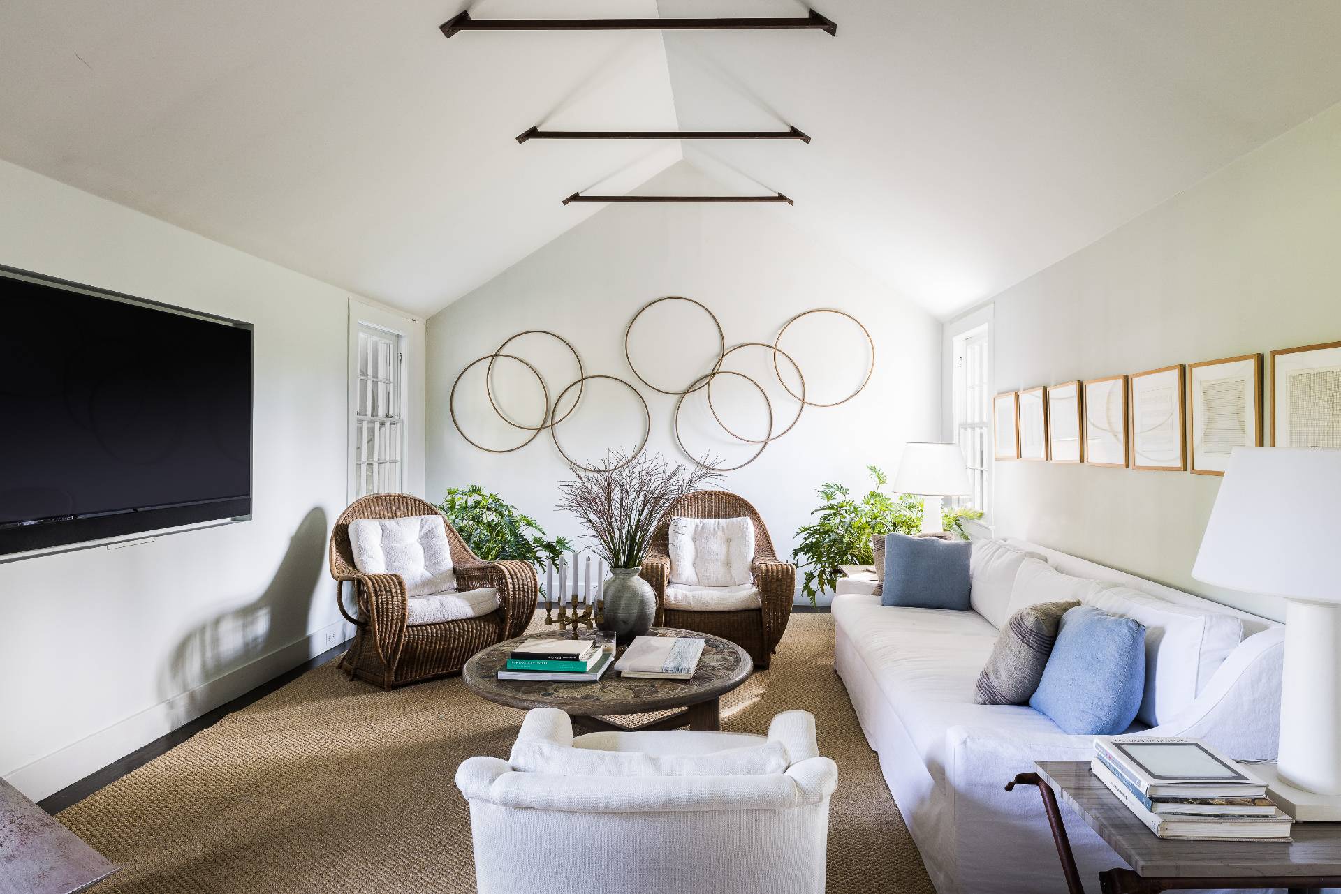 56 Sagaponack Road Bridgehampton, NY 11932 - Photo 6 of 23 a living room with furniture a flat screen tv and a large window