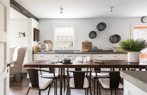 a kitchen with a table and chairs in it