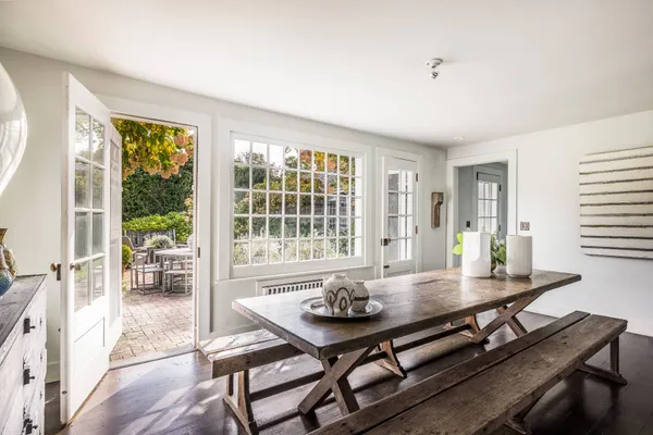 a view of a dining room with furniture window and outside view