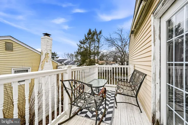 a view of balcony with furniture