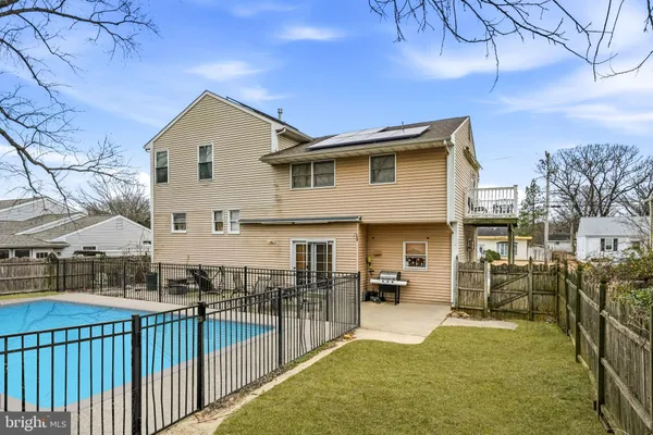 a view of a house with wooden fence