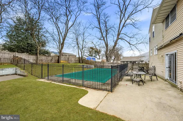 a view of a park with iron fence