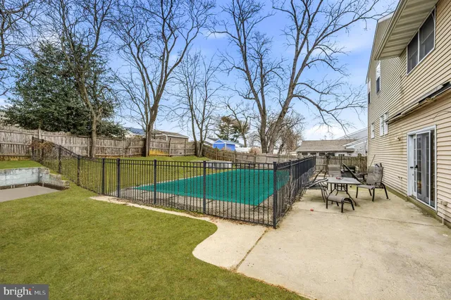 a view of a park with iron fence